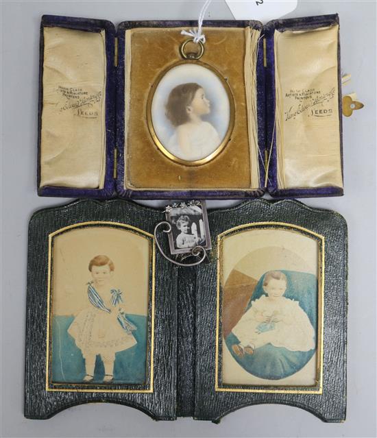 An oval miniature watercolour portrait of a young girl, a miniature silver photograph frame and a pair of overpainted photographs